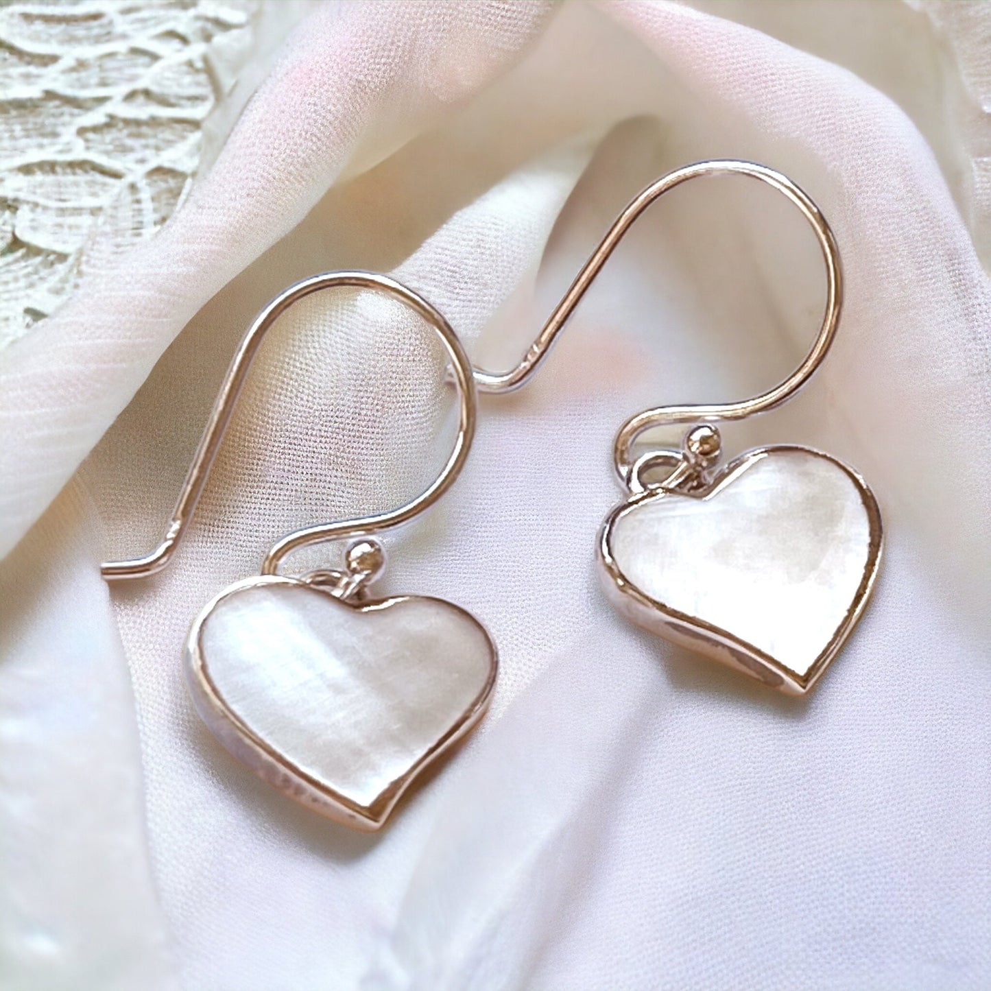"Heart-Shaped Mother-of-Pearl Earrings in 925 Sterling Silver…