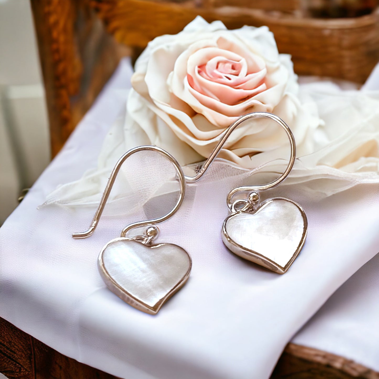 "Heart-Shaped Mother-of-Pearl Earrings in 925 Sterling Silver…