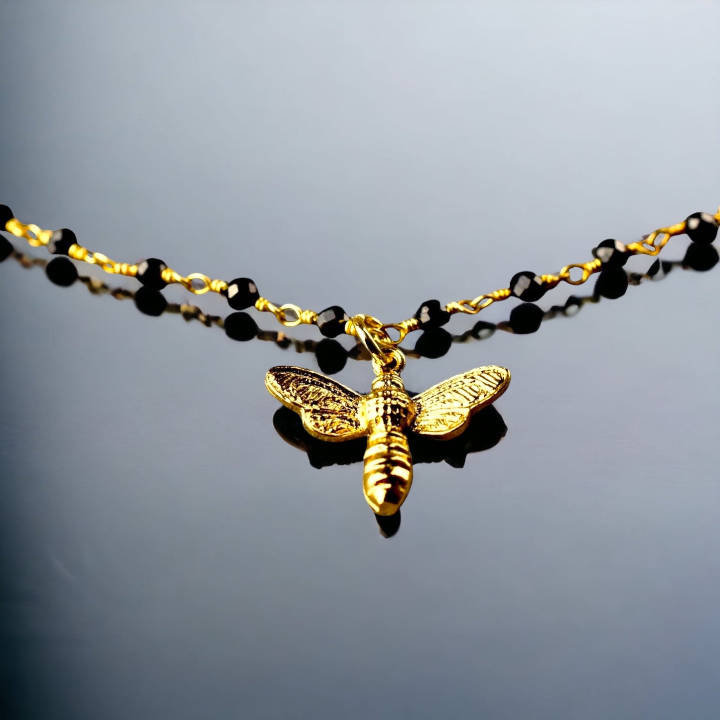 Gold bumblebee bracelet with onyx - gemstone bracelet with petite…