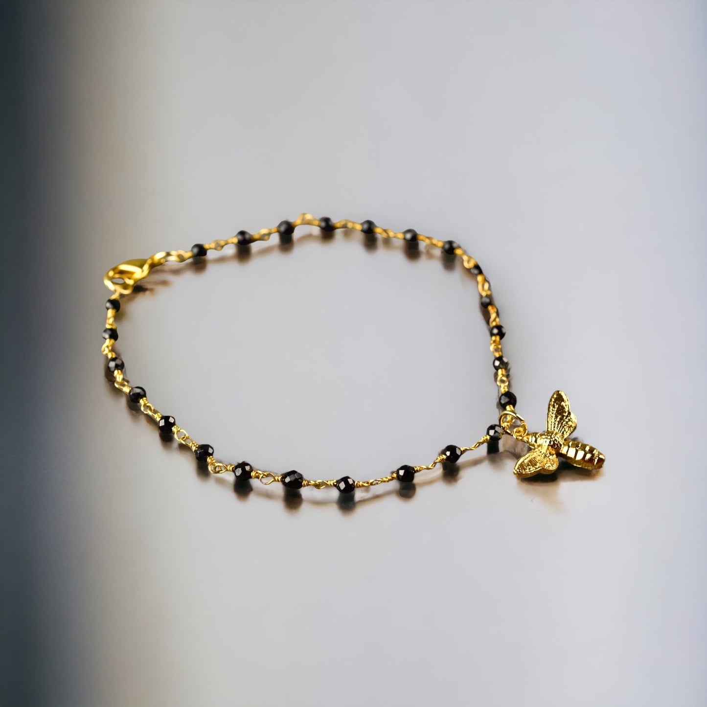 Gold bumblebee bracelet with onyx - gemstone bracelet with petite…