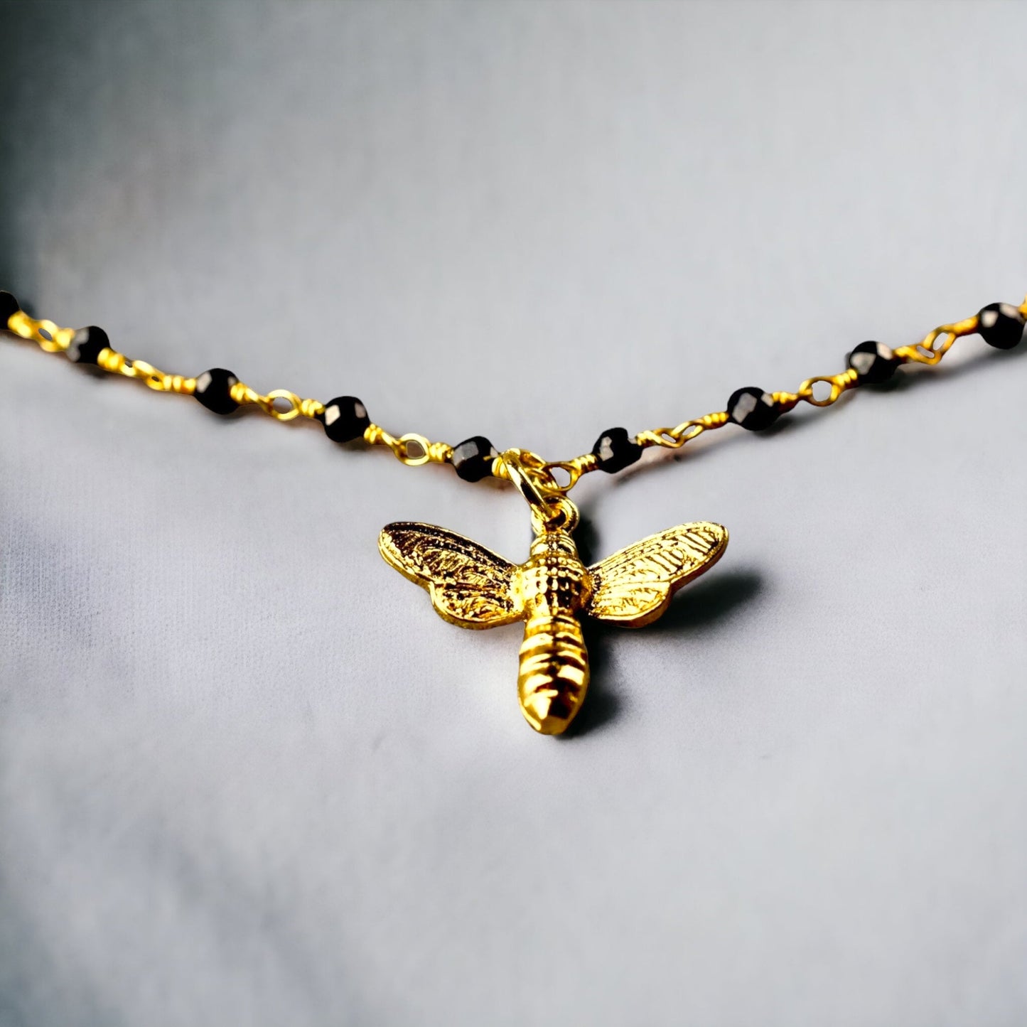 Gold bumblebee bracelet with onyx - gemstone bracelet with petite…