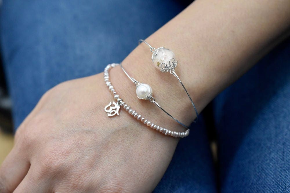 Bangles in the double pack real pulse flowers and freshwater pearl…