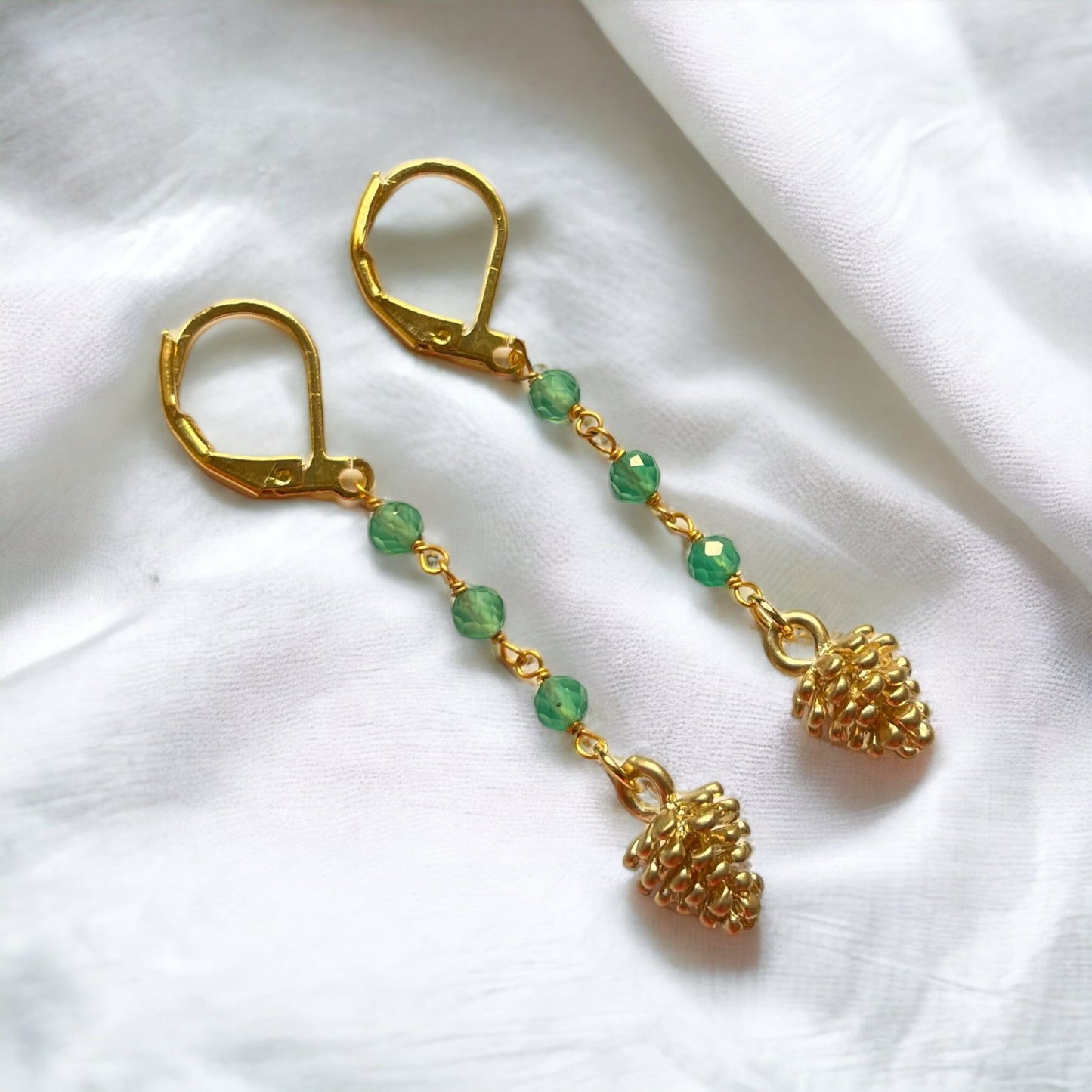 Elegant gold-plated earrings with aventurine beads and pine cone…
