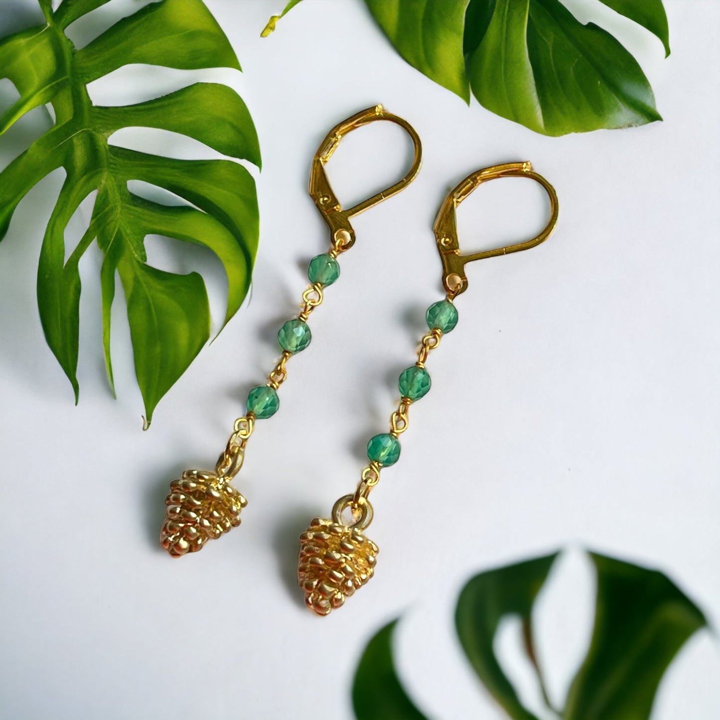 Elegant gold-plated earrings with aventurine beads and pine cone…